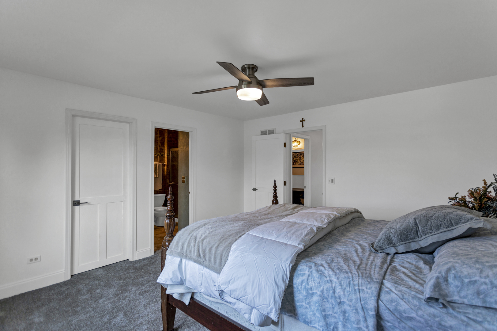 1908 Prairie Ridge Drive Plainfield, IL 60586 - Photo 16 of 34 a bedroom with a bed and a chandelier