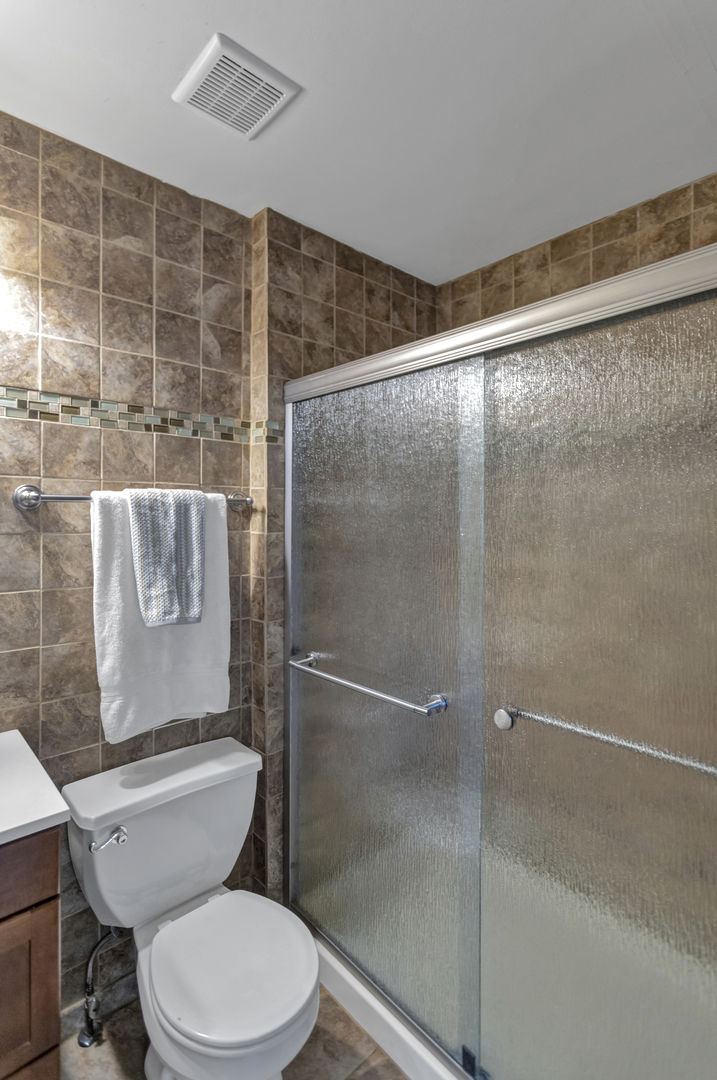 1908 Prairie Ridge Drive Plainfield, IL 60586 - Photo 18 of 34 a bathroom with a toilet and a shower