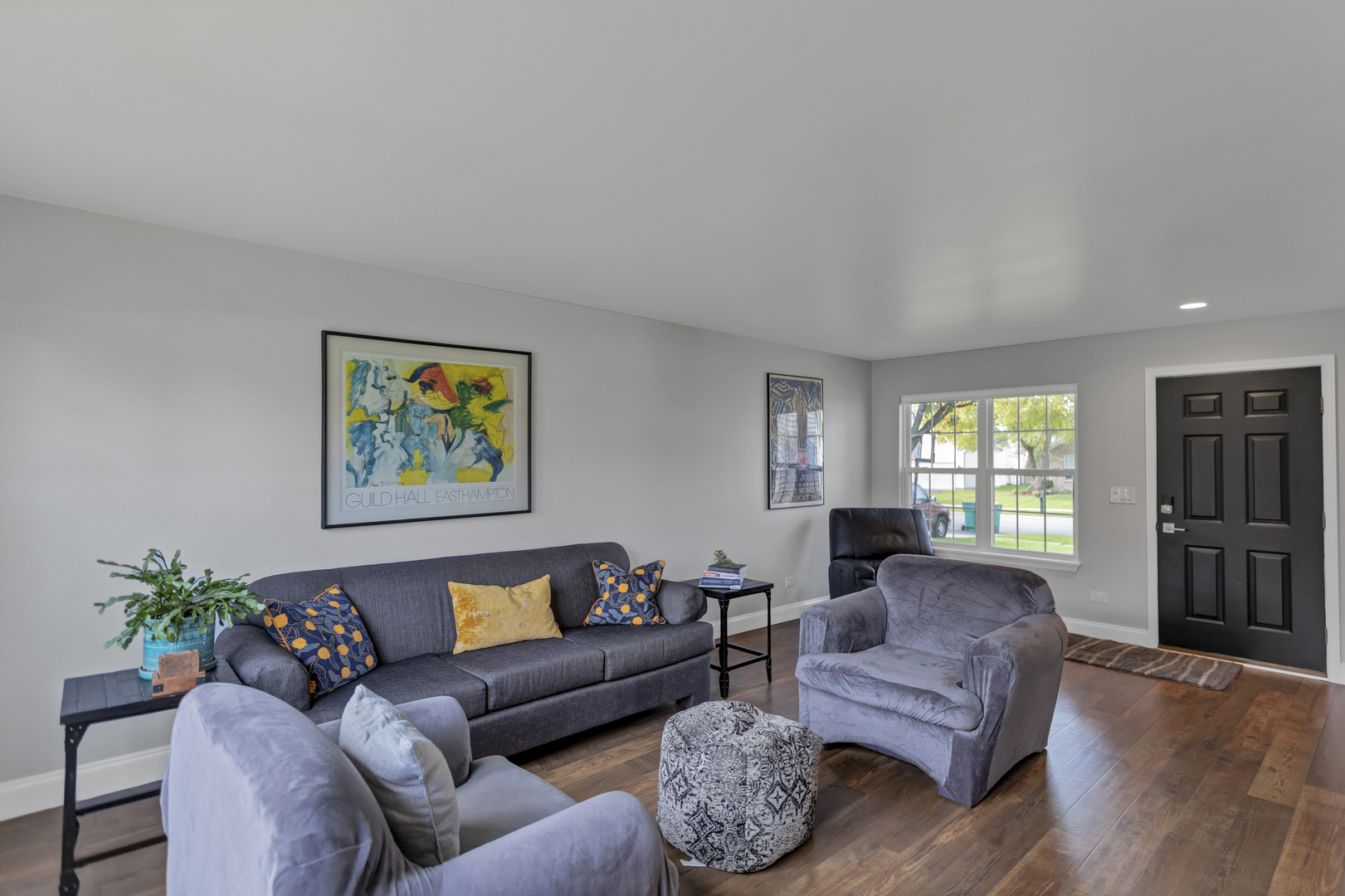 1908 Prairie Ridge Drive Plainfield, IL 60586 - Photo 2 of 34 a living room with furniture a chandelier and a window