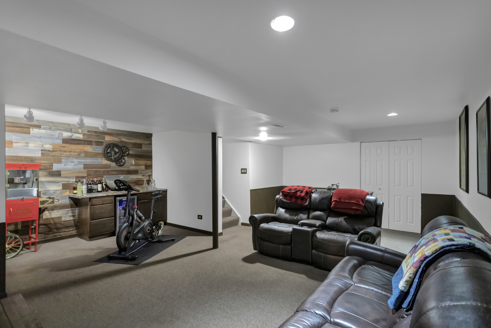 1908 Prairie Ridge Drive Plainfield, IL 60586 - Photo 28 of 34 a living room with furniture and a flat screen tv
