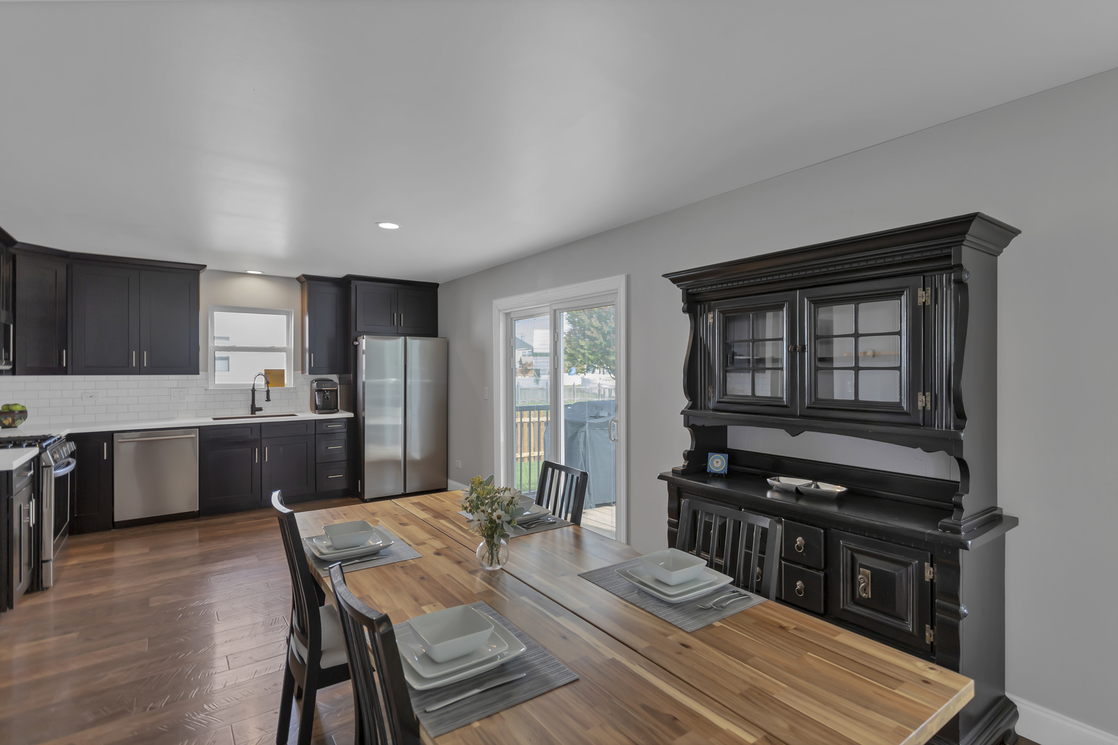 1908 Prairie Ridge Drive Plainfield, IL 60586 - Photo 5 of 34 a kitchen with a table chairs a sink and appliances