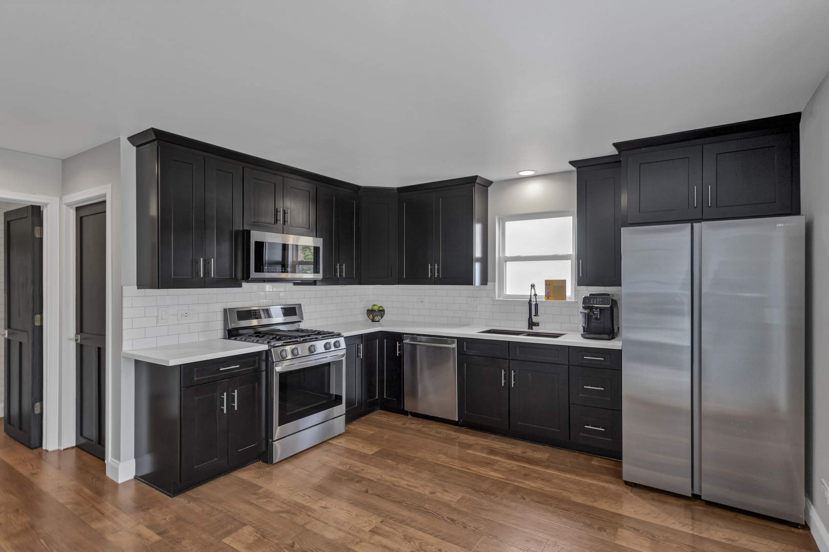 1908 Prairie Ridge Drive Plainfield, IL 60586 - Photo 8 of 34 a large kitchen with cabinets and stainless steel appliances