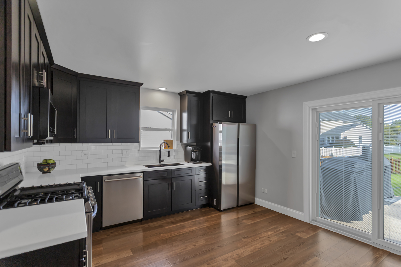 1908 Prairie Ridge Drive Plainfield, IL 60586 - Photo 9 of 34 a kitchen with stainless steel appliances a sink and a refrigerator