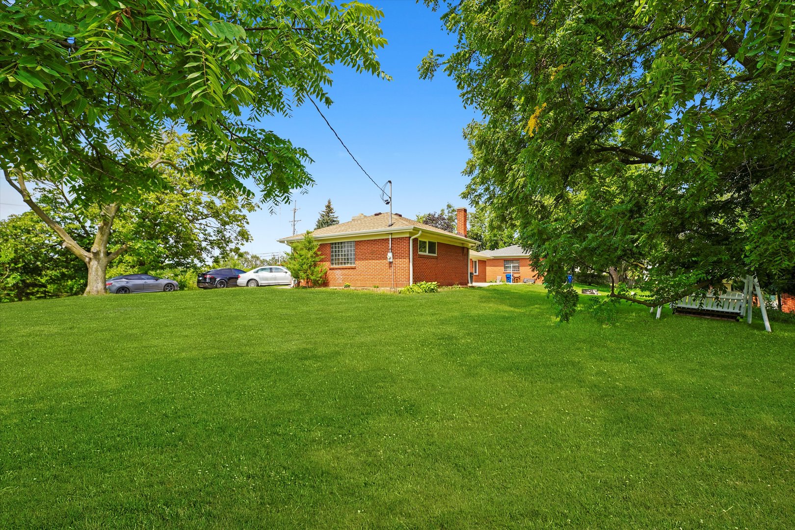 2N101 Glen Ellyn Road Glendale Heights, IL 60139 - Photo 20 of 34 a front view of a house with garden