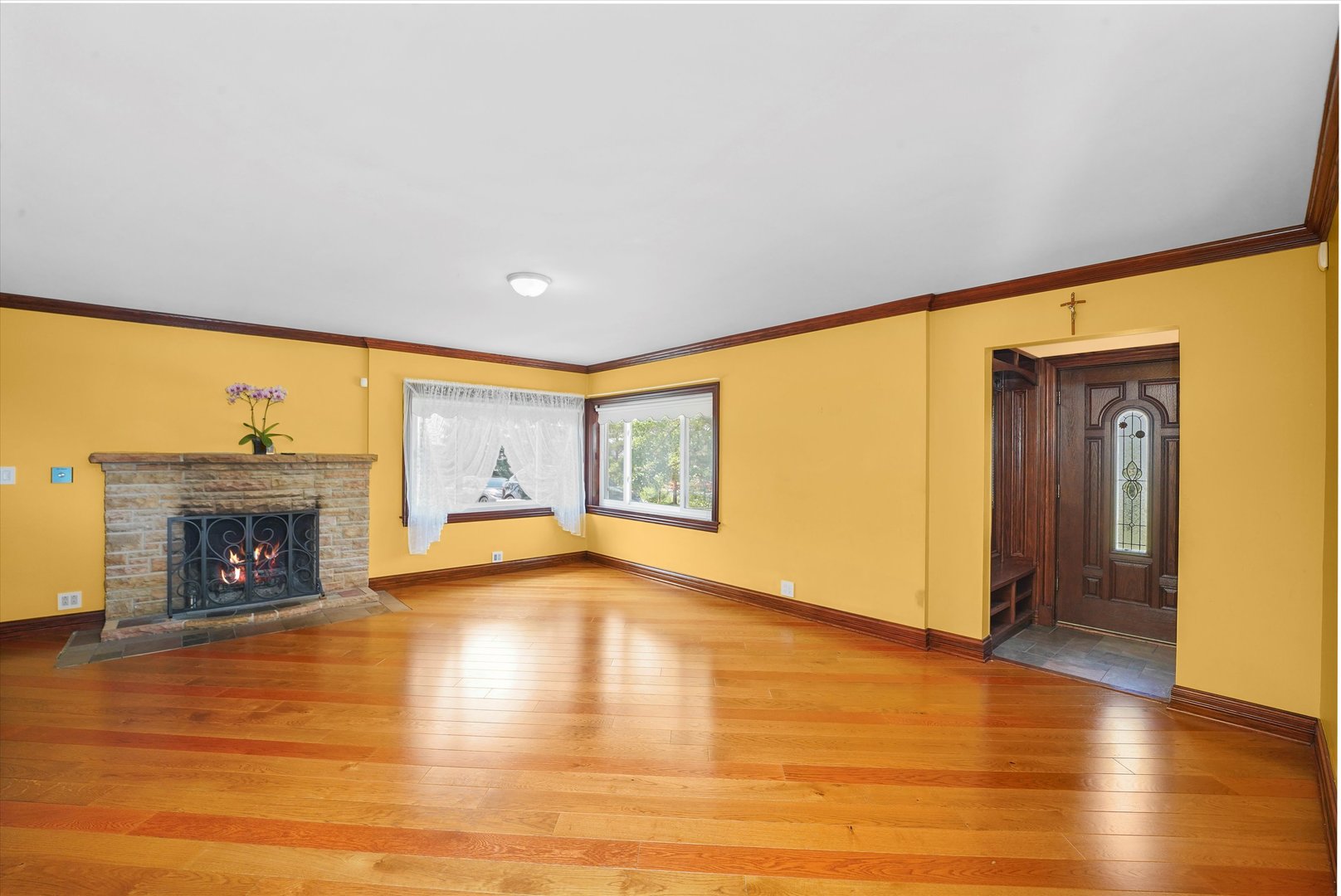 2N101 Glen Ellyn Road Glendale Heights, IL 60139 - Photo 2 of 34 a view of an empty room with a fireplace and a window