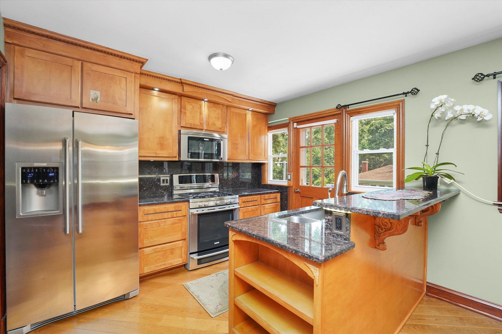 2N101 Glen Ellyn Road Glendale Heights, IL 60139 - Photo 6 of 34 a kitchen with stainless steel appliances granite countertop a sink stove and refrigerator