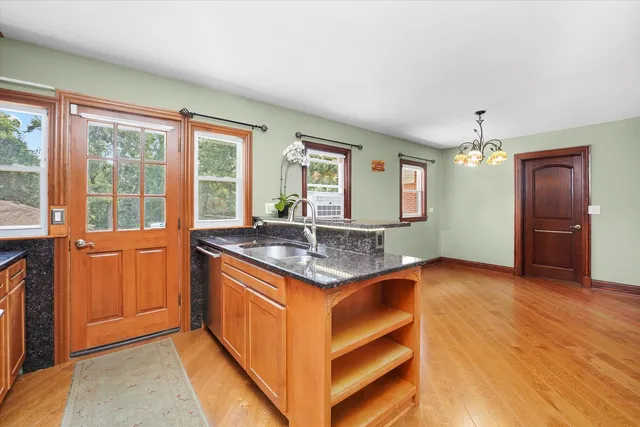 a kitchen with stainless steel appliances granite countertop a stove and a refrigerator