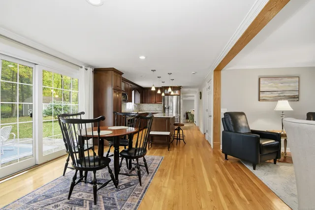 a view of a dining room with furniture window and wooden floor