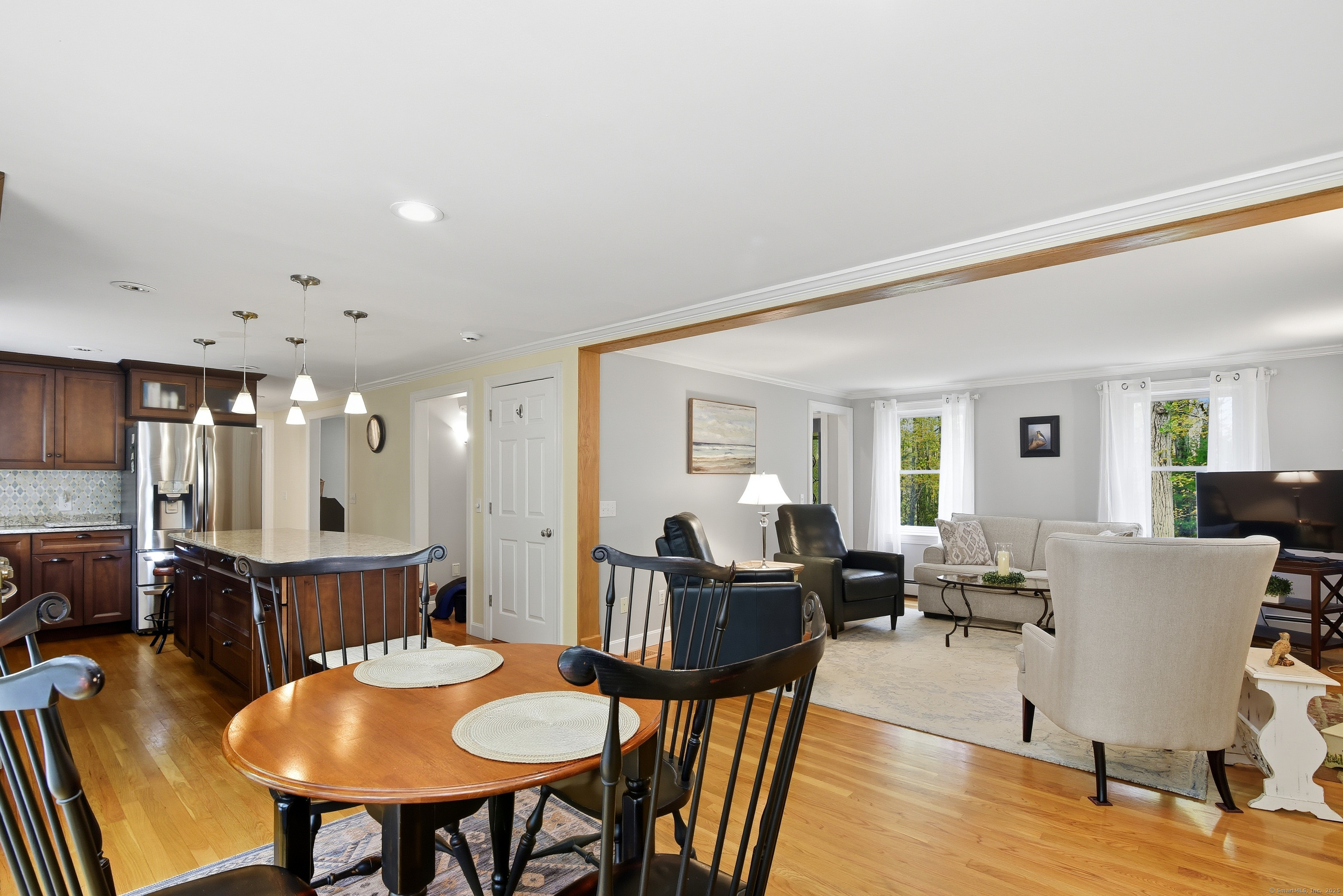 26 Center Road Woodstock, CT 06281 - Photo 14 of 39 a view of a dining room with furniture and wooden floor