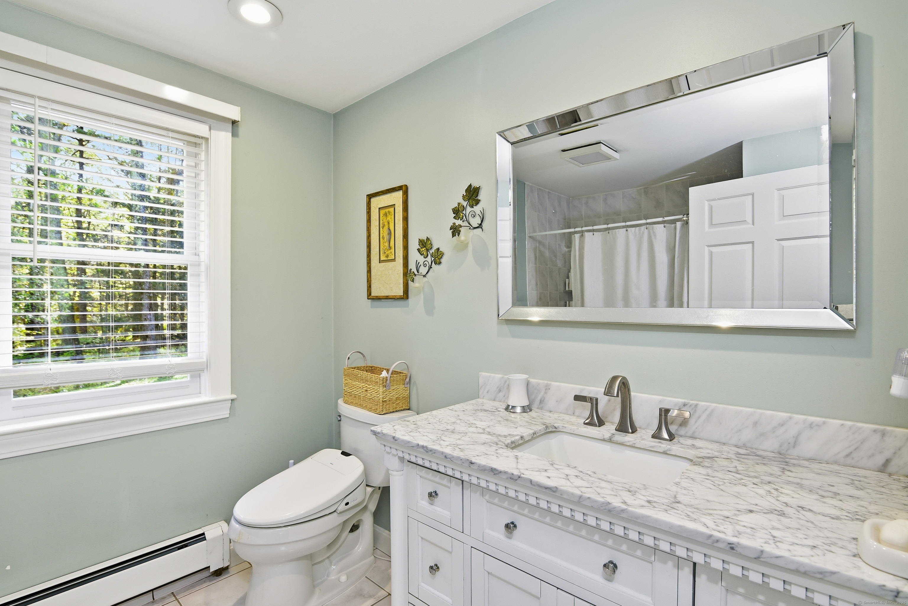 26 Center Road Woodstock, CT 06281 - Photo 19 of 39 a bathroom with a granite countertop sink mirror vanity and toilet