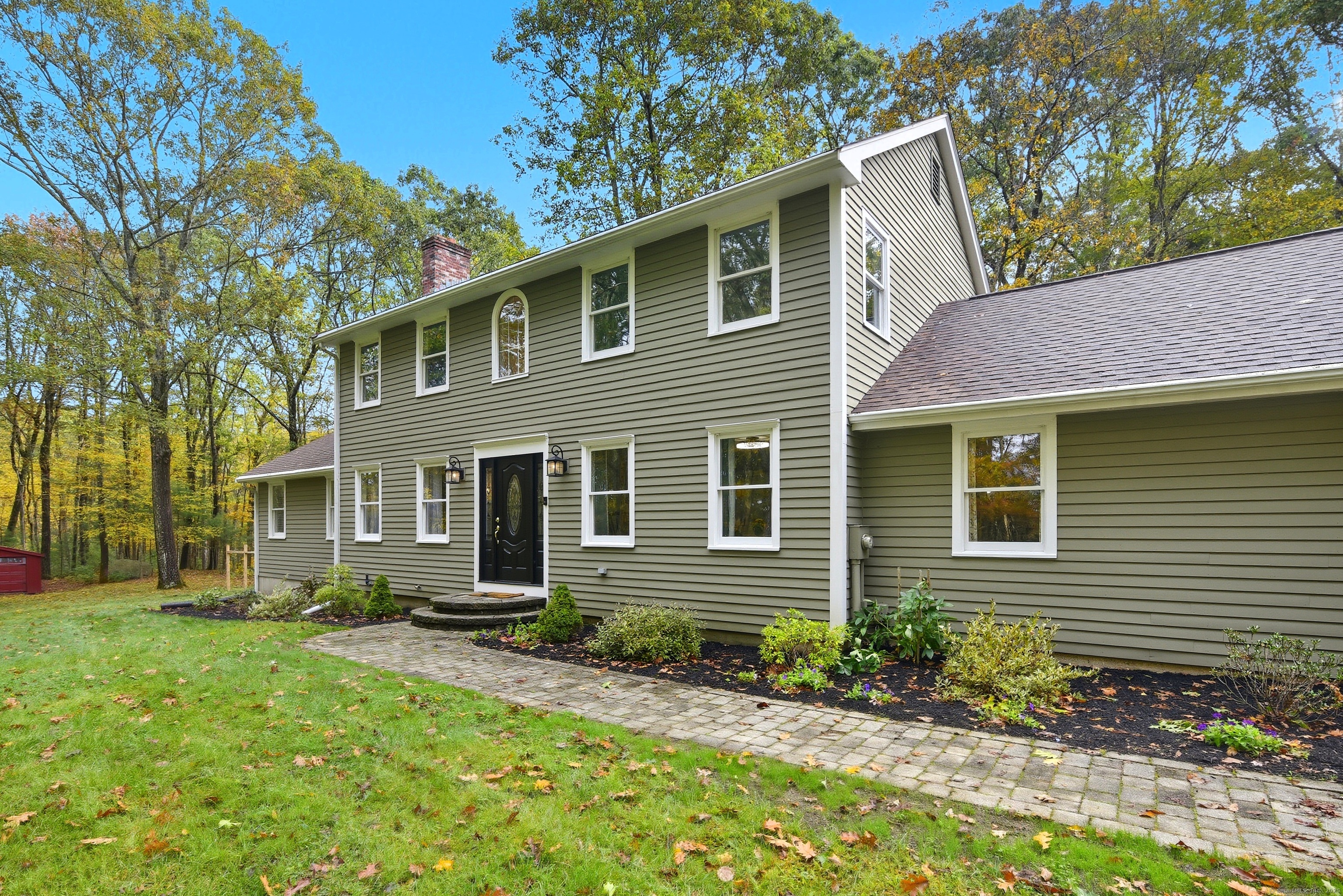 26 Center Road Woodstock, CT 06281 - Photo 2 of 39 a front view of a house with a yard
