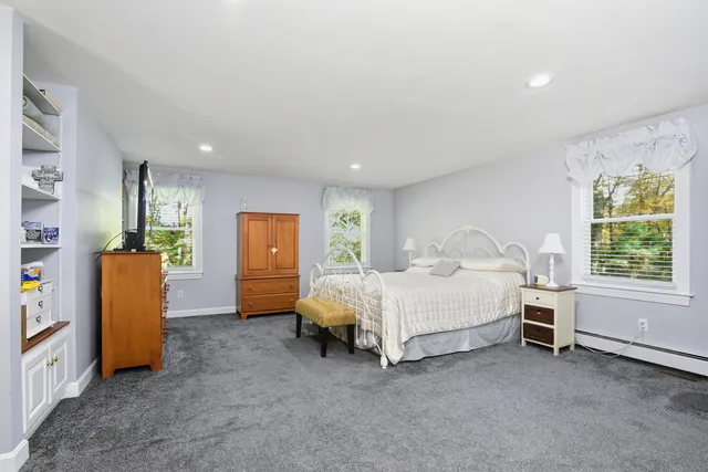 a bed room with a bed and a window