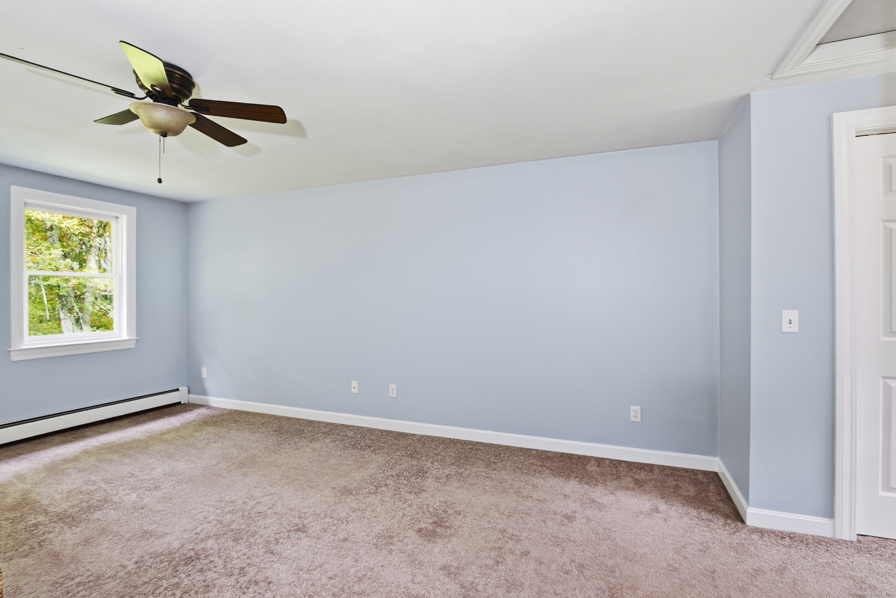 26 Center Road Woodstock, CT 06281 - Photo 24 of 39 an empty room with a window and a fan