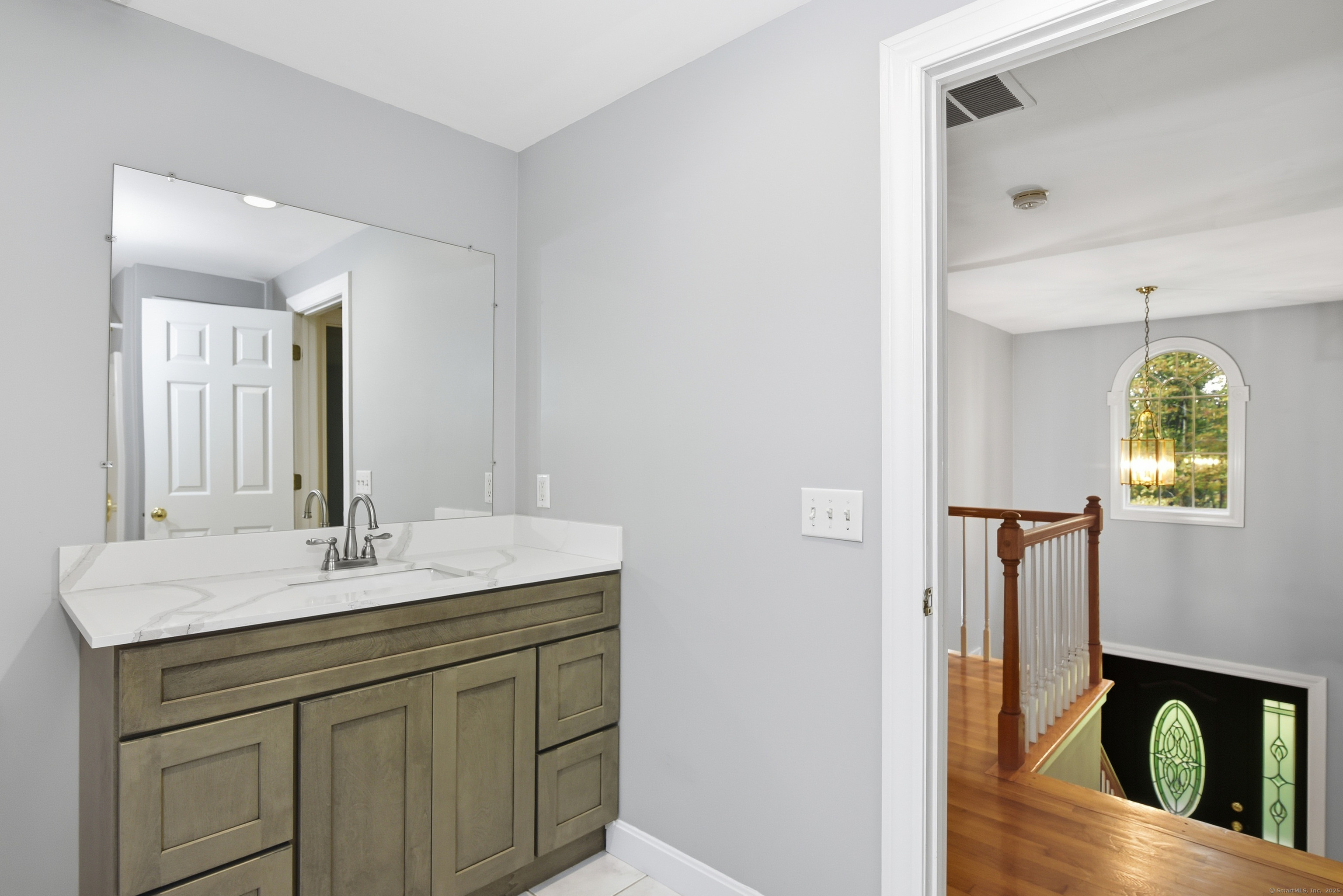 26 Center Road Woodstock, CT 06281 - Photo 25 of 39 a bathroom with a granite countertop sink and a mirror
