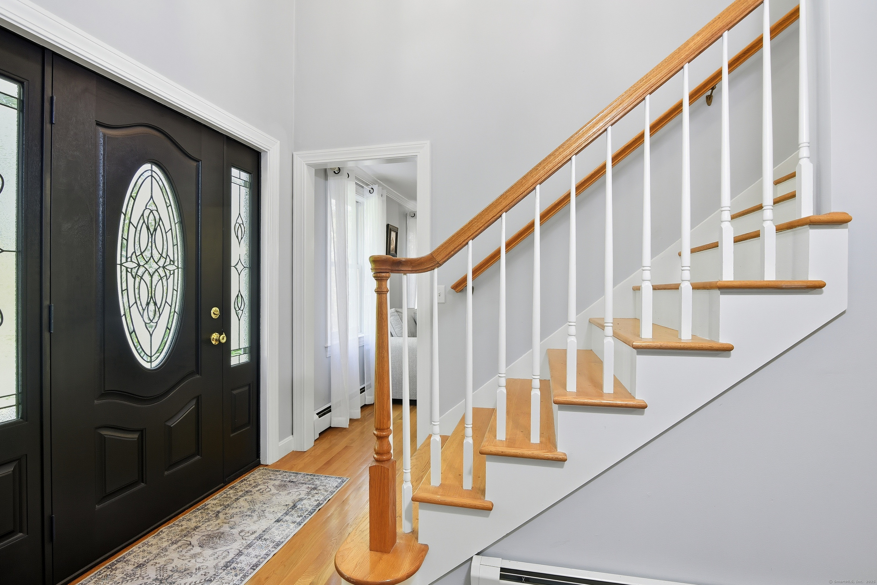 26 Center Road Woodstock, CT 06281 - Photo 3 of 39 a view of staircase with wooden floor and a potted plant