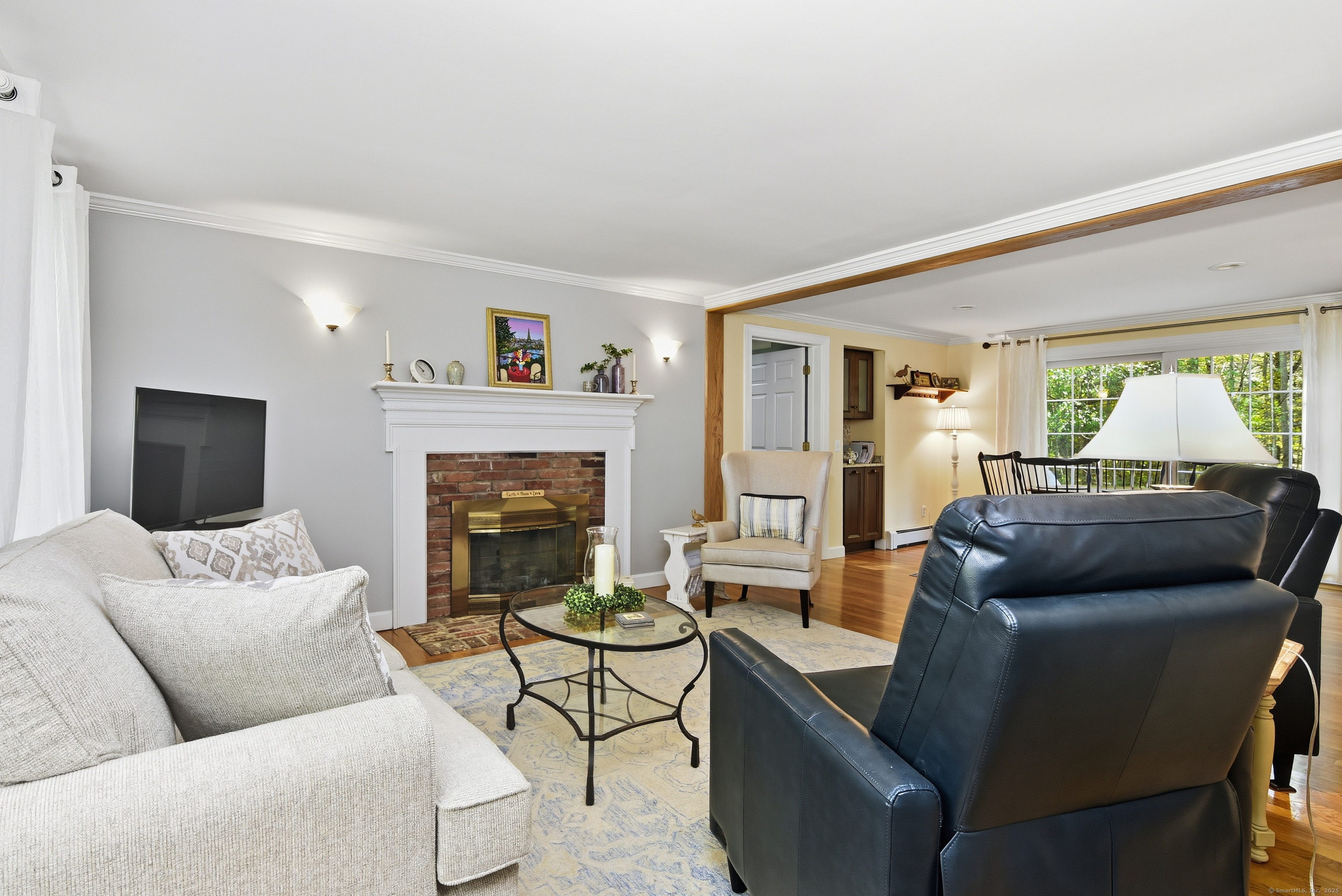 26 Center Road Woodstock, CT 06281 - Photo 4 of 39 a living room with furniture and a fireplace
