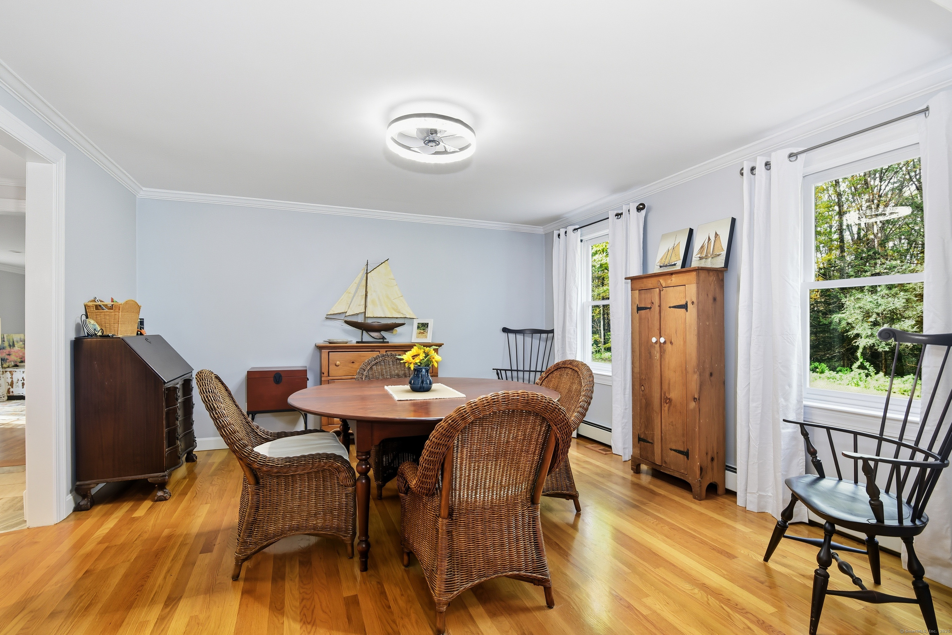 26 Center Road Woodstock, CT 06281 - Photo 6 of 39 a view of a dining room with furniture window and wooden floor