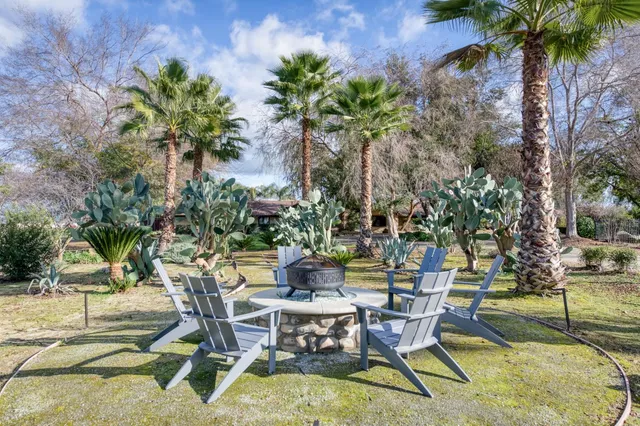 a room with pool table and windows