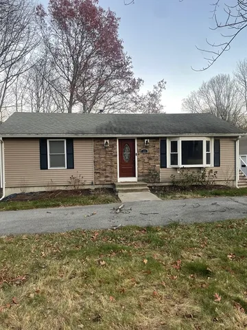 a view of a house with a yard