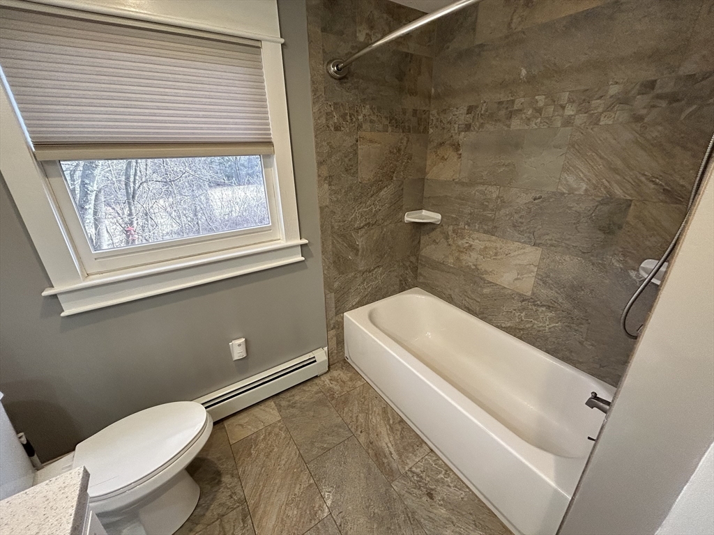 256 Old Webster Road, Unit 1 Oxford, MA 01540 - Photo 15 of 19 a bathroom with a toilet and a shower
