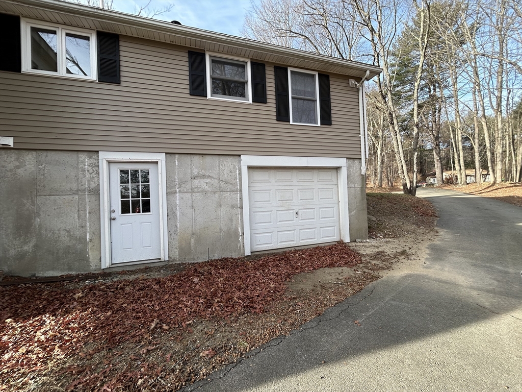 256 Old Webster Road, Unit 1 Oxford, MA 01540 - Photo 2 of 19 a front view of a house