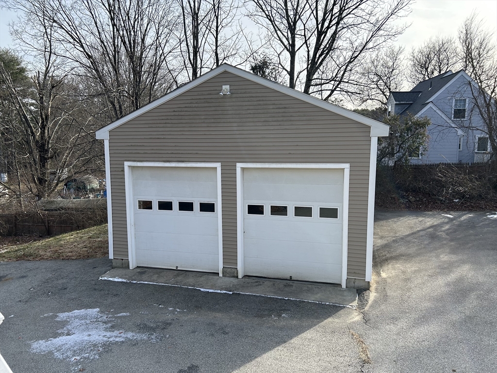 256 Old Webster Road, Unit 1 Oxford, MA 01540 - Photo 3 of 19 a front view of a house with a yard