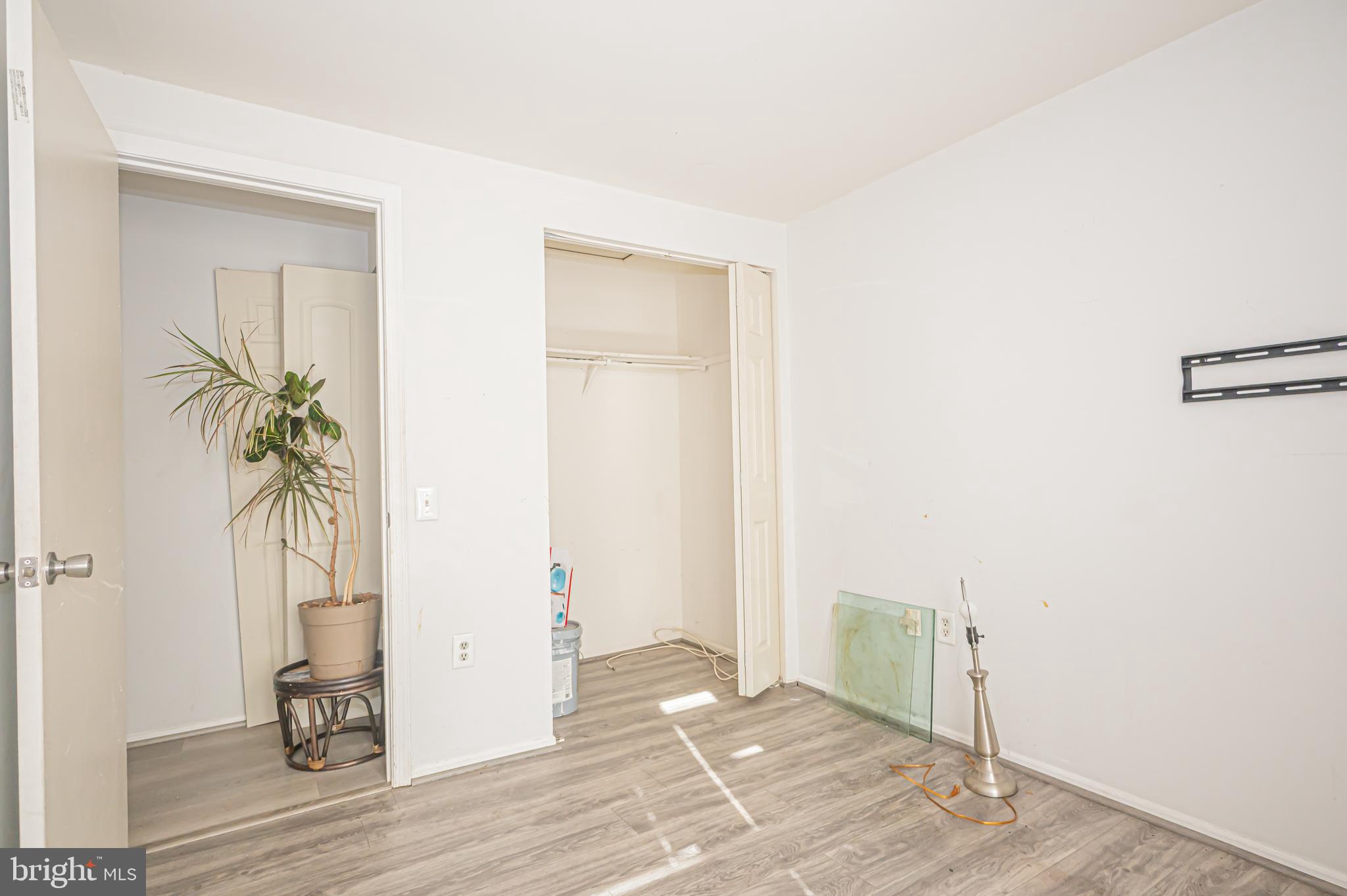 2637 Rooks Head Place Waldorf, MD 20602 - Photo 12 of 18 an empty room with wooden floor and windows
