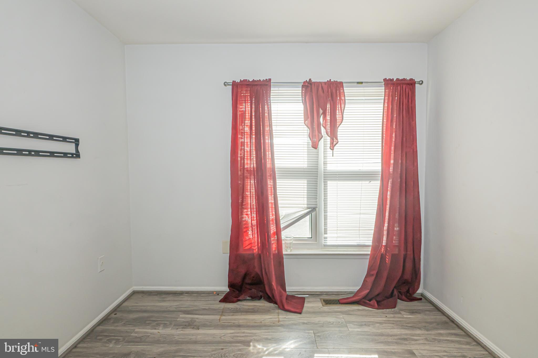 2637 Rooks Head Place Waldorf, MD 20602 - Photo 13 of 18 a view of a room with wooden floor and a window