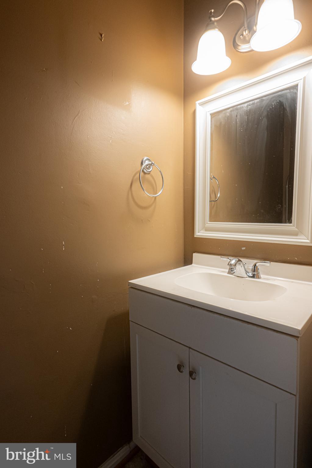 2637 Rooks Head Place Waldorf, MD 20602 - Photo 16 of 18 a bathroom with a sink and mirror