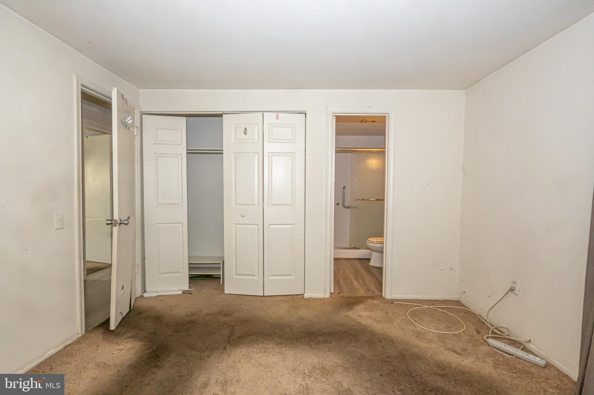 2637 Rooks Head Place Waldorf, MD 20602 - Photo 17 of 18 an empty room with closet and mirror