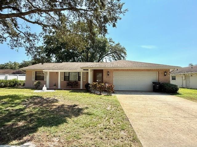 613 Andrew Street Altamonte Springs, FL 32714 - Photo 1 of 1 a front view of a house with a yard and garage