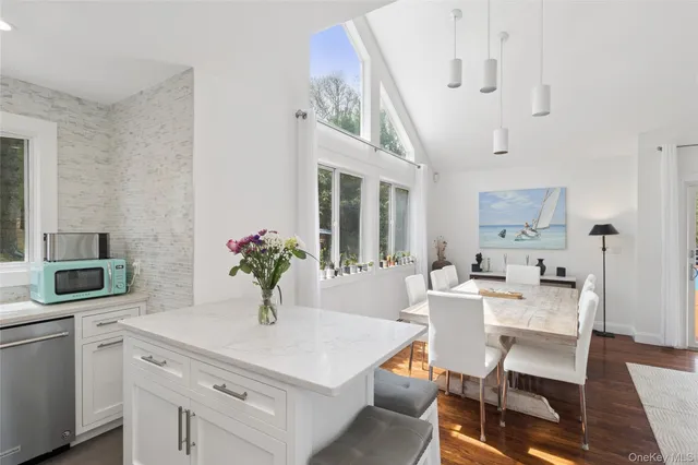 a view of backyard with seating space and trees