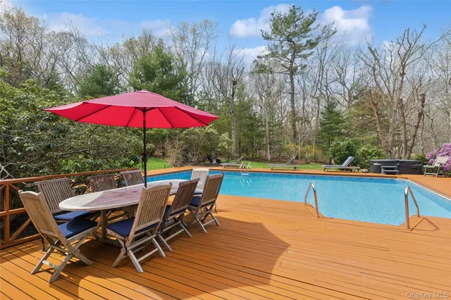 an aerial view of a house with yard swimming pool and outdoor seating