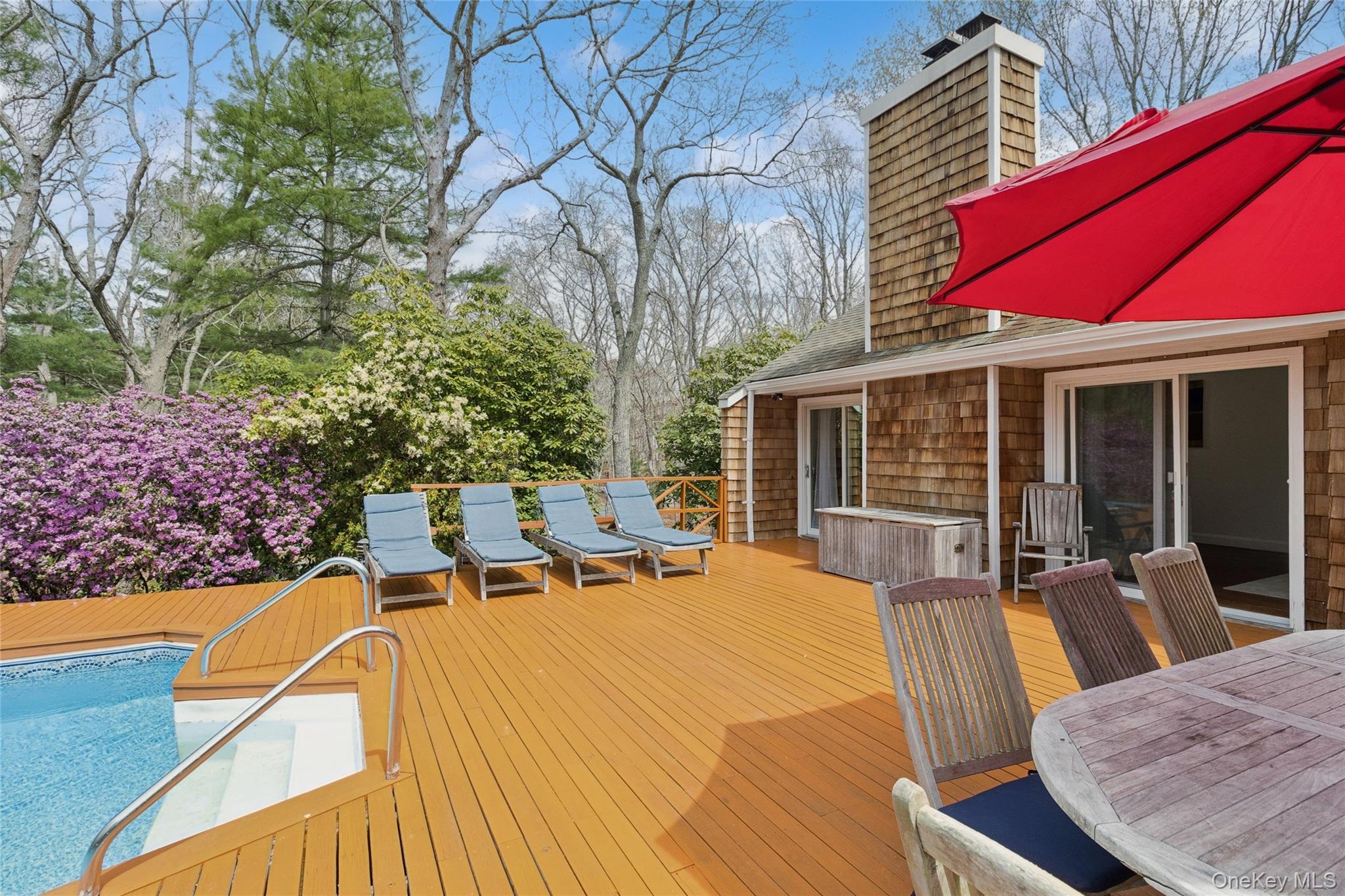 27 Ely Brook Road East Hampton, NY 11937 - Photo 17 of 50 Wooden terrace featuring a fenced in pool