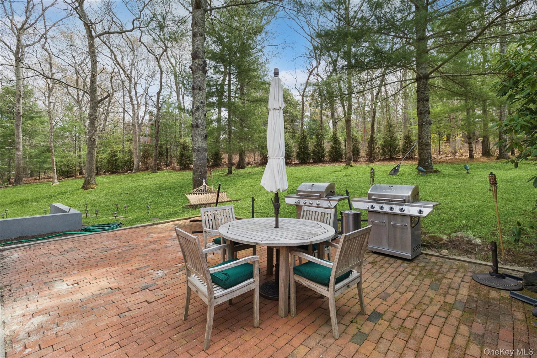 27 Ely Brook Road East Hampton, NY 11937 - Photo 21 of 50 View of patio / terrace featuring outdoor dining space and area for grilling