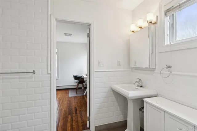 an aerial view of a house with a yard and swimming pool