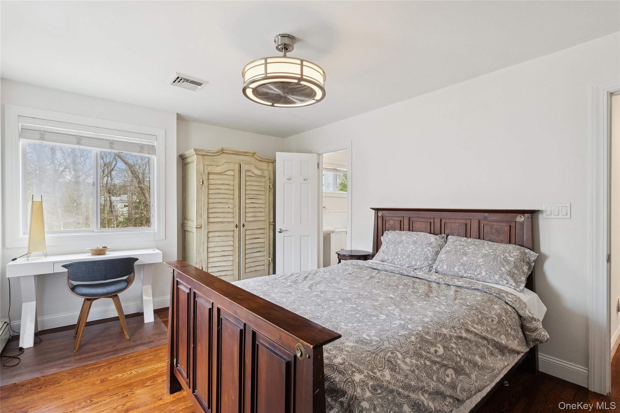 27 Ely Brook Road East Hampton, NY 11937 - Photo 31 of 50 Bedroom with light wood-type flooring, visible vents, and baseboards