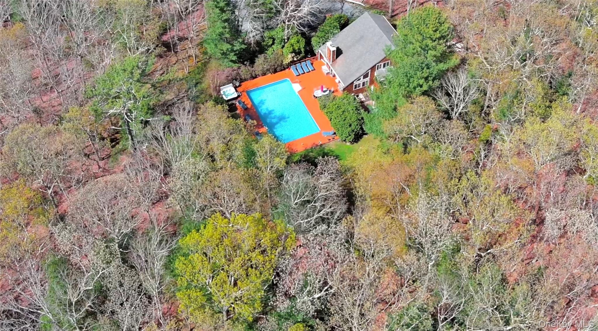 27 Ely Brook Road East Hampton, NY 11937 - Photo 37 of 50 Aerial overview of property's location with a pool area and a forest