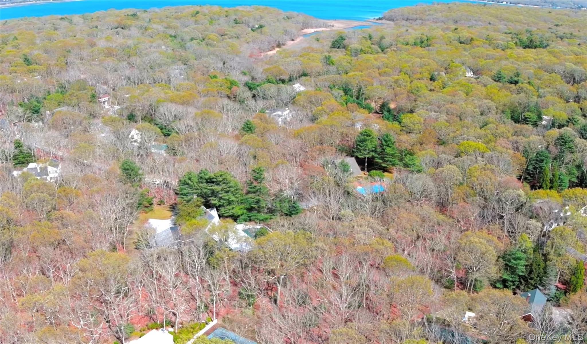 27 Ely Brook Road East Hampton, NY 11937 - Photo 40 of 50 Aerial view of property and surrounding area with a forest and a large body of water