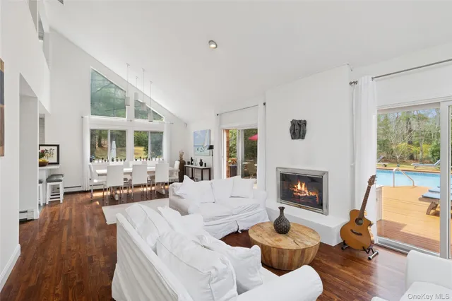 a kitchen with kitchen island a stove a table and chairs in it