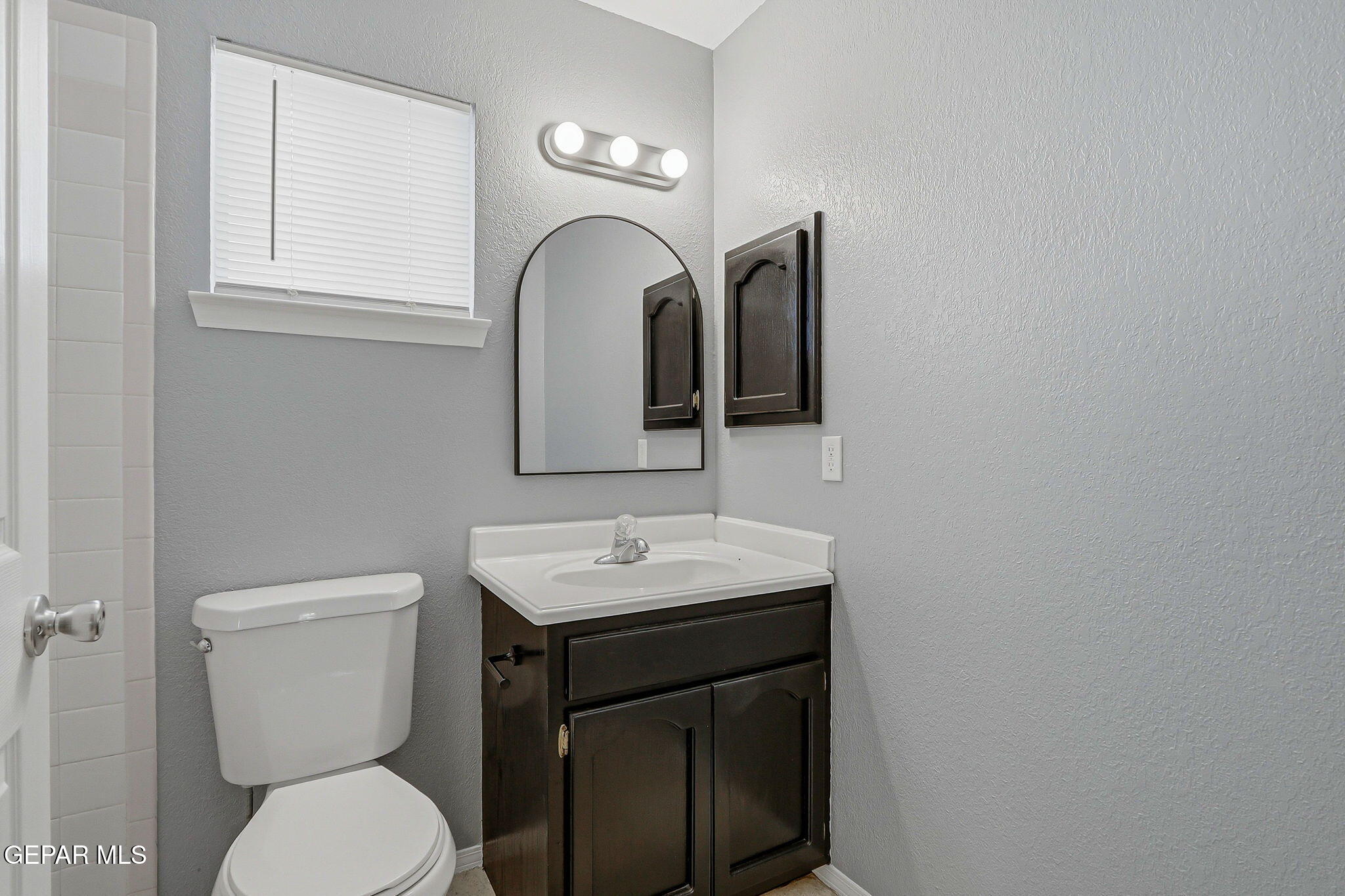 1767 Painted Quail Place El Paso, TX 79936 - Photo 11 of 13 a bathroom with a toilet sink and mirror