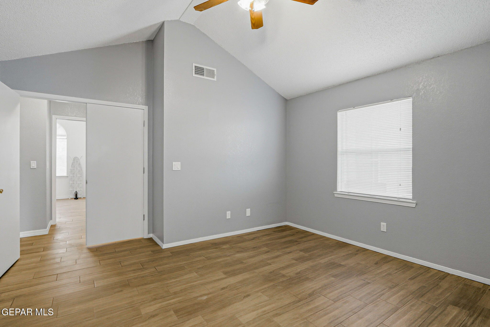1767 Painted Quail Place El Paso, TX 79936 - Photo 4 of 13 a view of empty room with wooden floor and fan