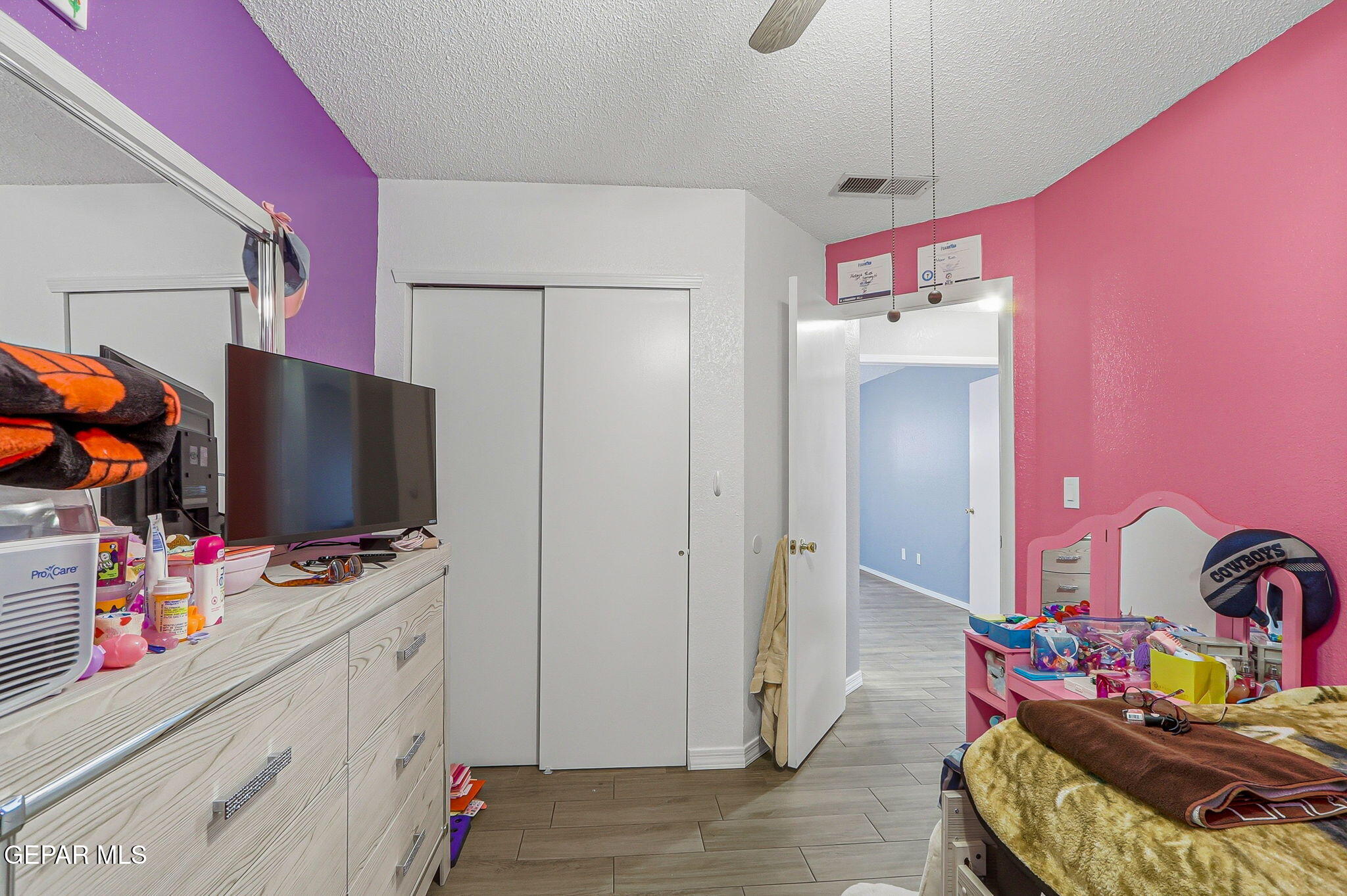 1767 Painted Quail Place El Paso, TX 79936 - Photo 7 of 13 a bedroom with a bed and a flat screen tv