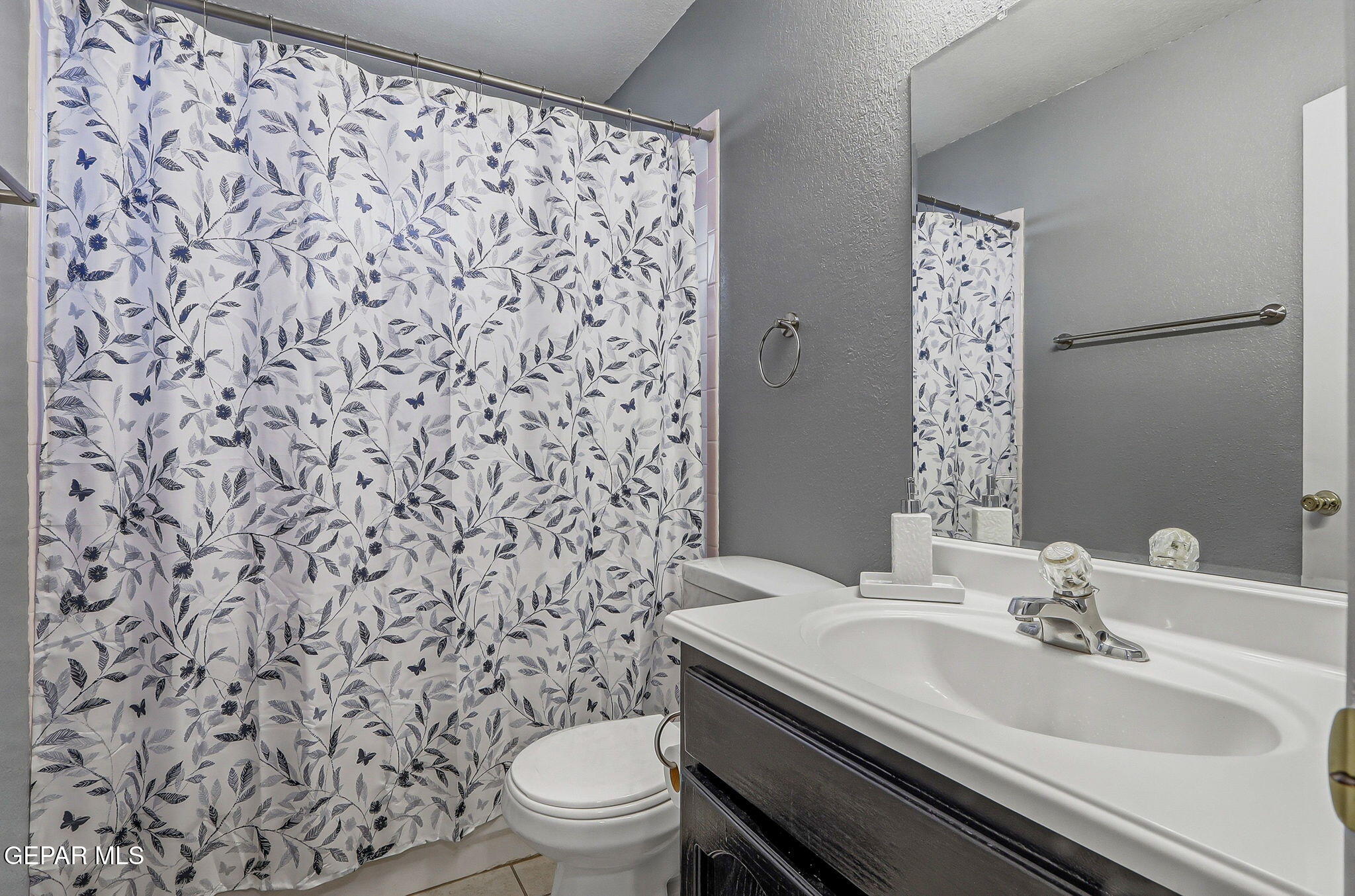 1767 Painted Quail Place El Paso, TX 79936 - Photo 8 of 13 a bathroom with a sink toilet and shower