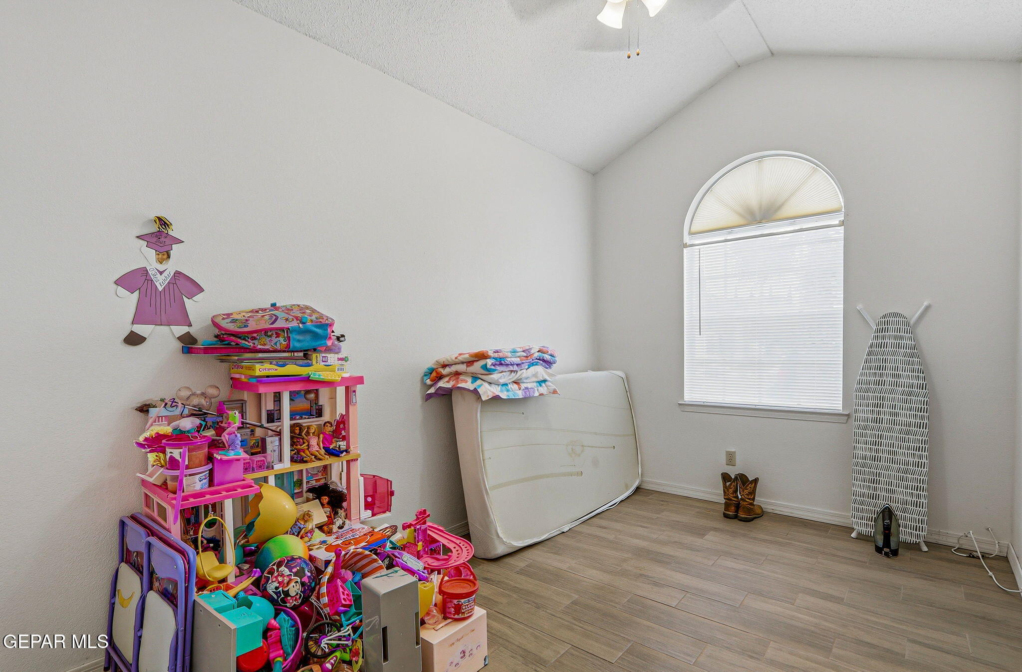 1767 Painted Quail Place El Paso, TX 79936 - Photo 10 of 13 a bedroom with furniture and a wooden floor