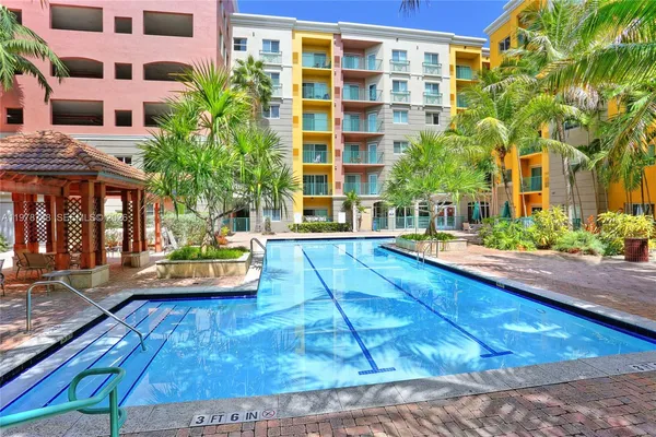 a view of a chairs and tables in the backyard of the house