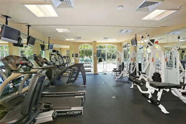 a living room with furniture a dining table and chairs with wooden floor