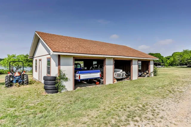 a view of a house with a yard and sitting area