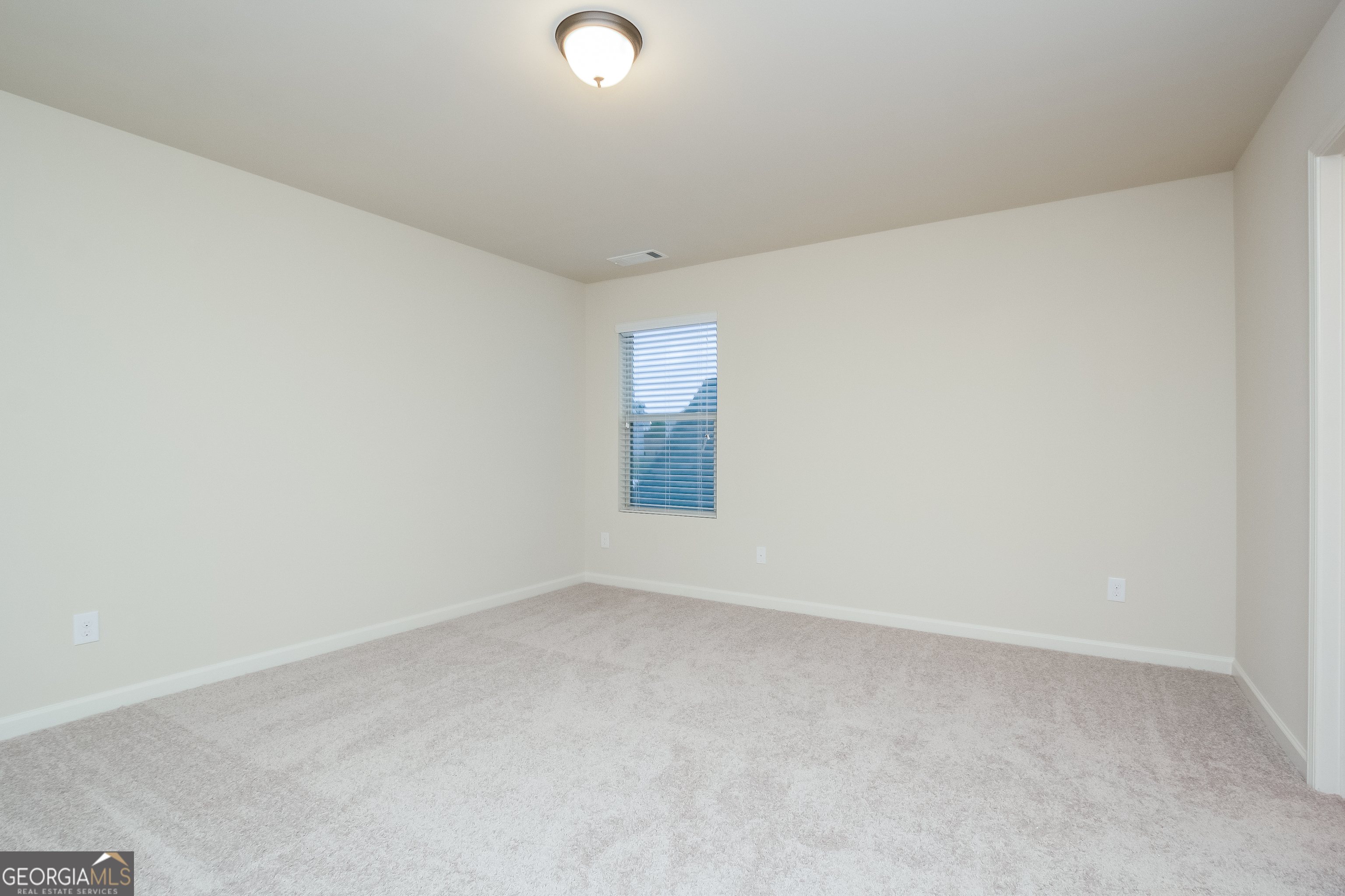 635 Independence Avenue Pendergrass, GA 30567 - Photo 11 of 15 an empty room with a window
