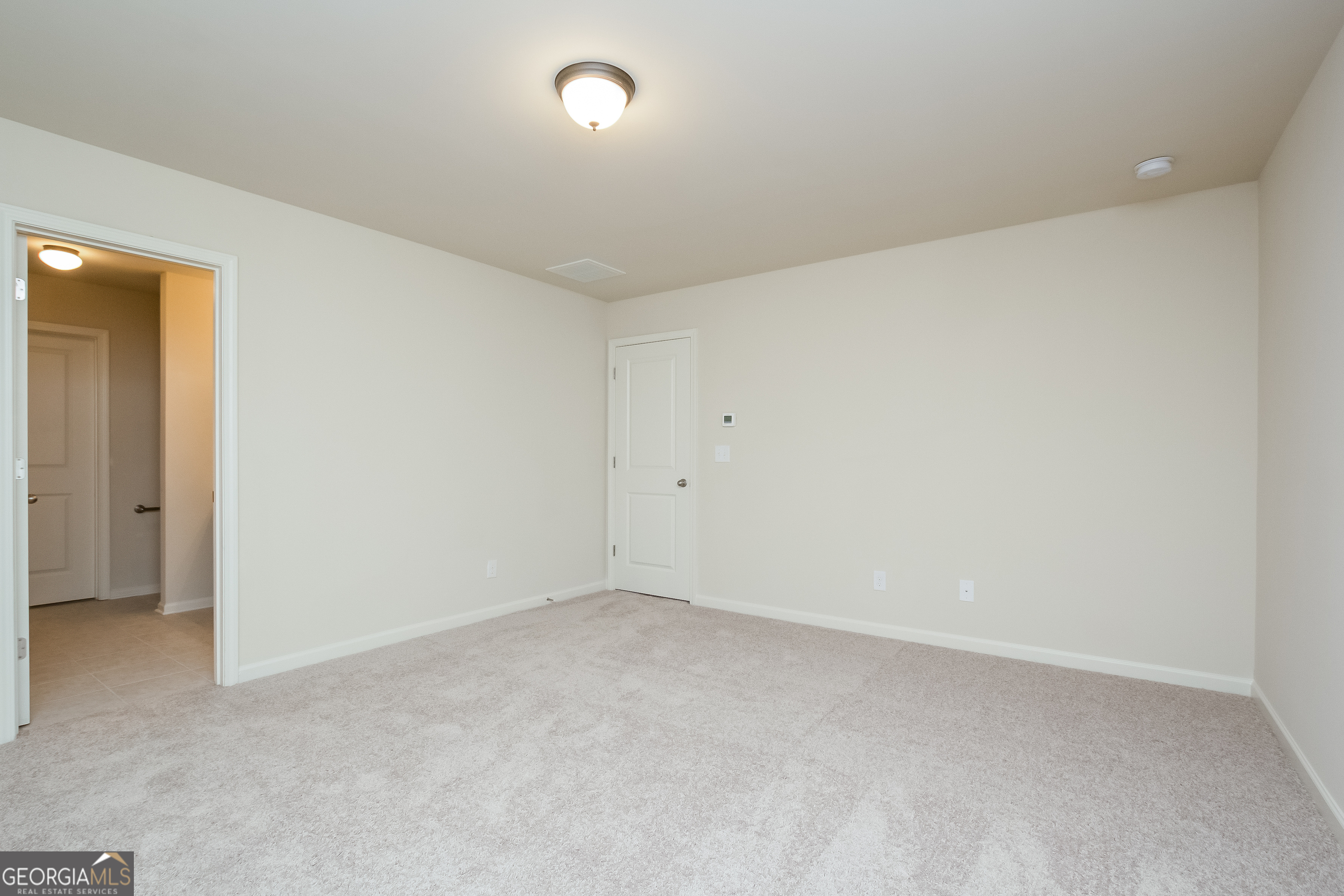 635 Independence Avenue Pendergrass, GA 30567 - Photo 12 of 15 an empty room with a natural light